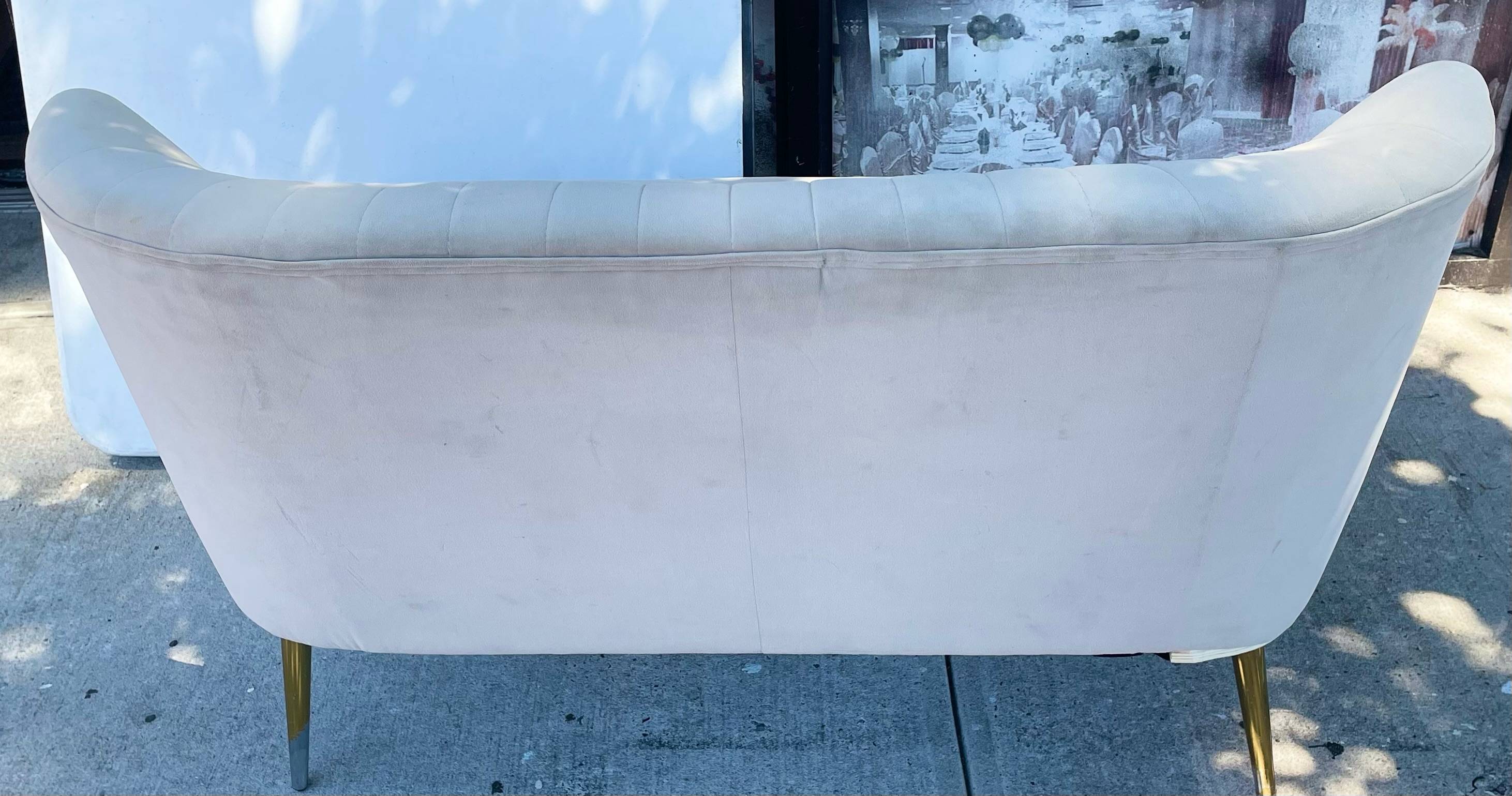 Tan Upholstered Love Seat